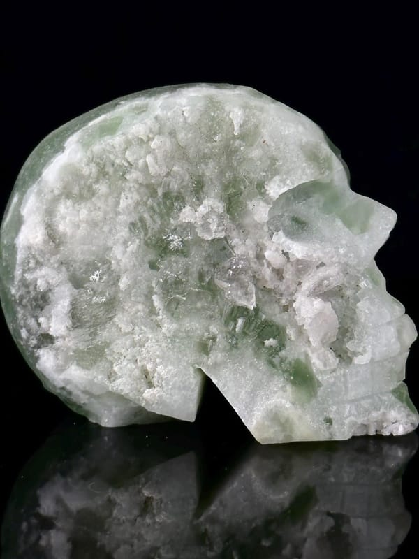 Top view of green fluorite skull showing carving detail
