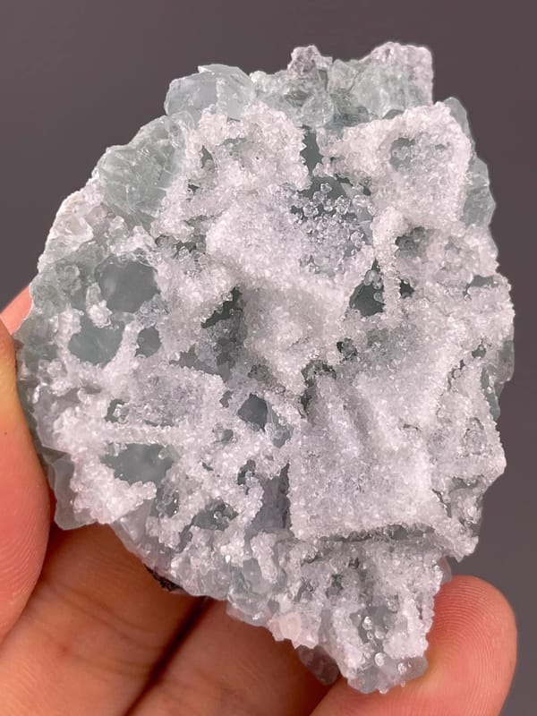 Back view of green fluorite with druzy quartz, China