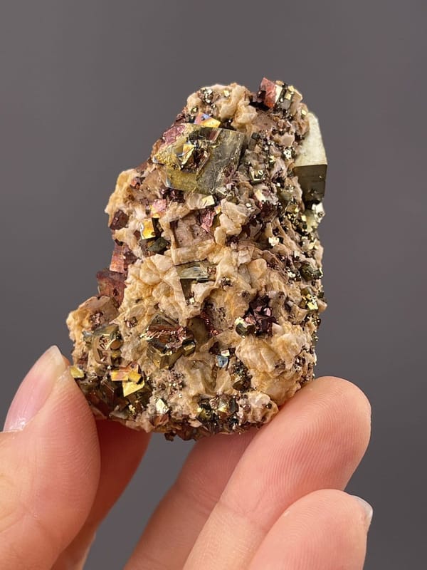 Detail of chalcopyrite surface showing metallic rainbow sheen