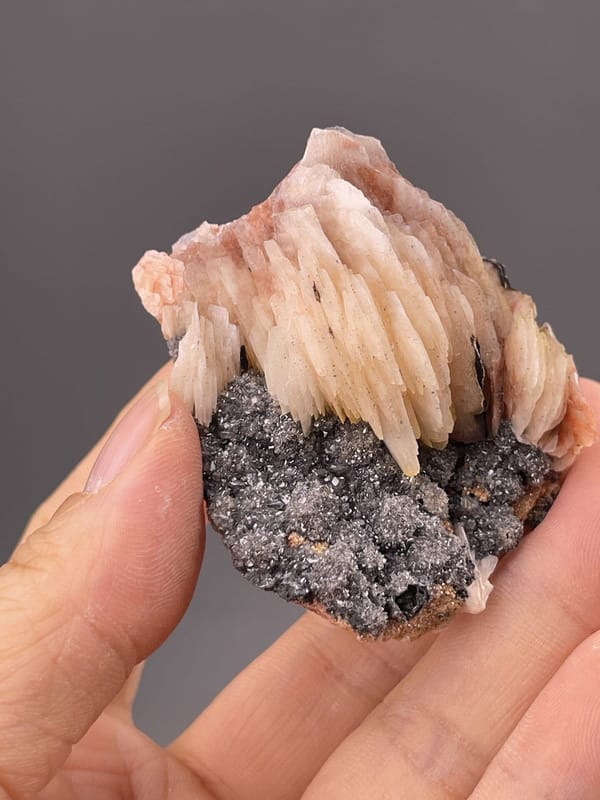 Close-up of barite crystal faces showing pink coloration