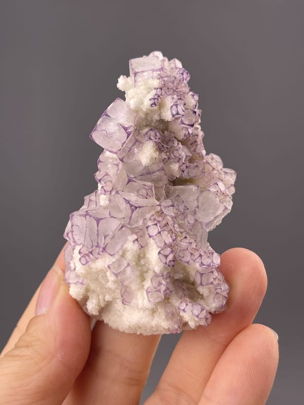Well-formed purple fluorite cube showing colour variation, 3 g
