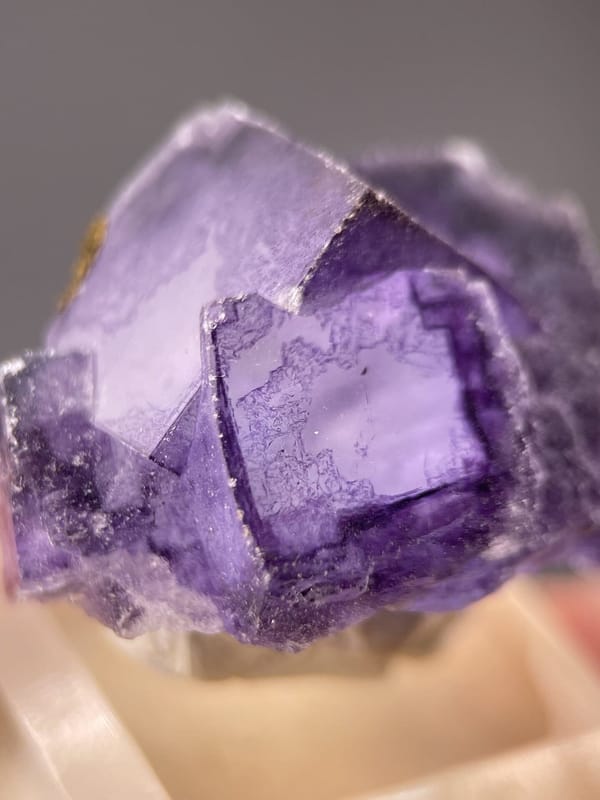Detail of fluorite crystal showing vitreous luster and purple tone