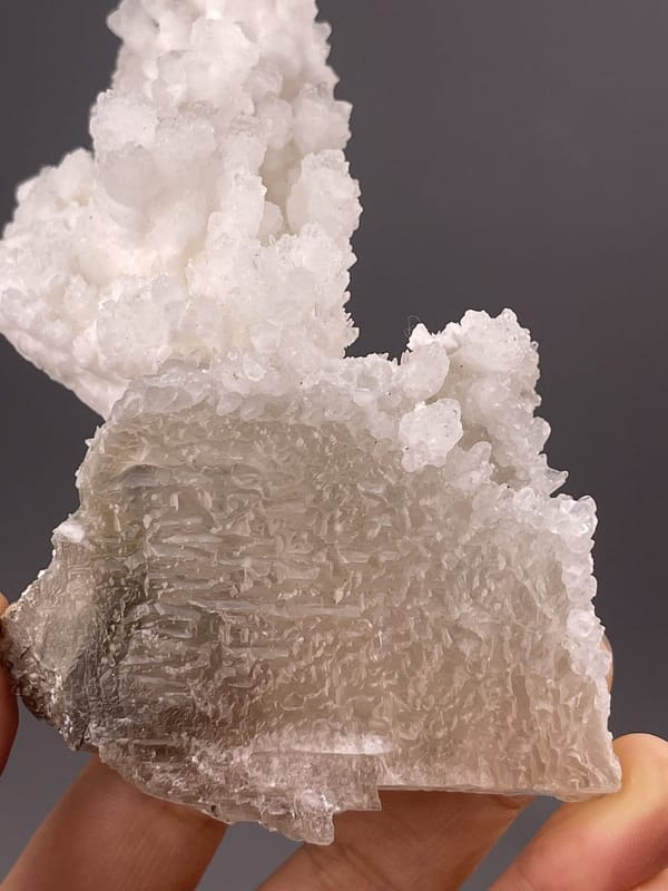 Close-up of calcite rhombohedral faces showing vitreous luster