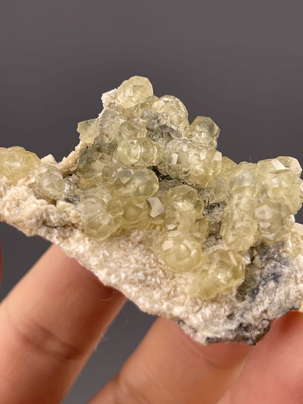 Pale yellow calcite showing rounded botryoidal surface, 0.9 g