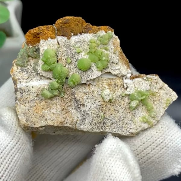 Apple-green pyromorphite balls on pale sandstone plate from Guangxi, China