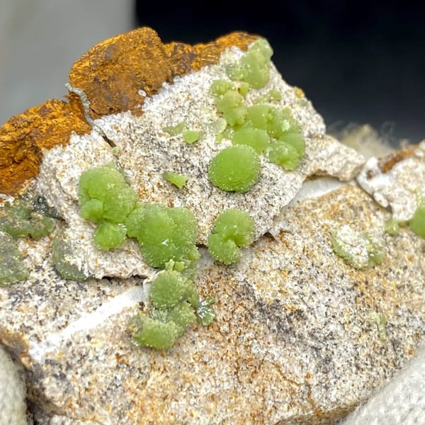 Apple-green pyromorphite balls on pale sandstone plate from Guangxi, China, view 3 of 9