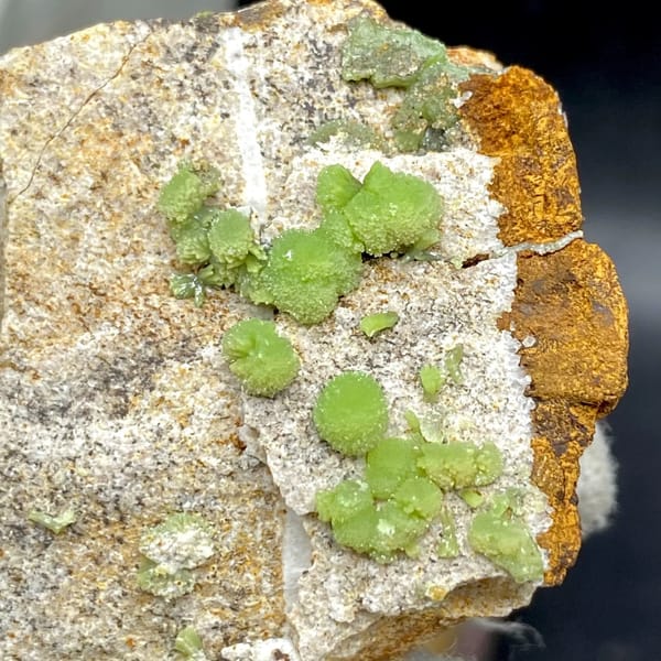 Apple-green pyromorphite balls on pale sandstone plate from Guangxi, China, view 4 of 9