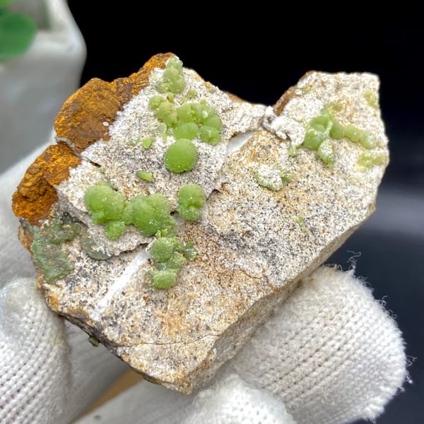 Apple-green pyromorphite balls on pale sandstone plate from Guangxi, China, view 8 of 9