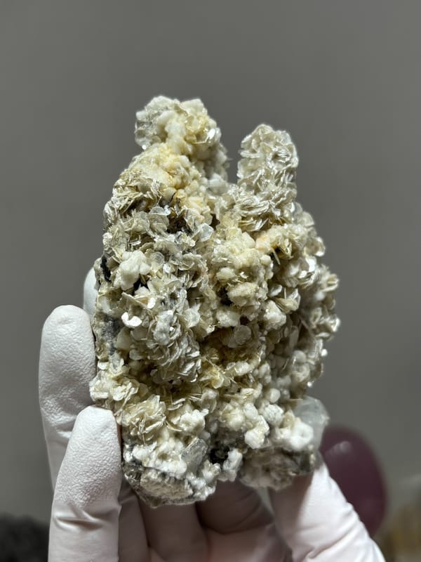 Plate of tan mica with small aquamarine crystals from Xuebaoding, Sichuan, China, second angle