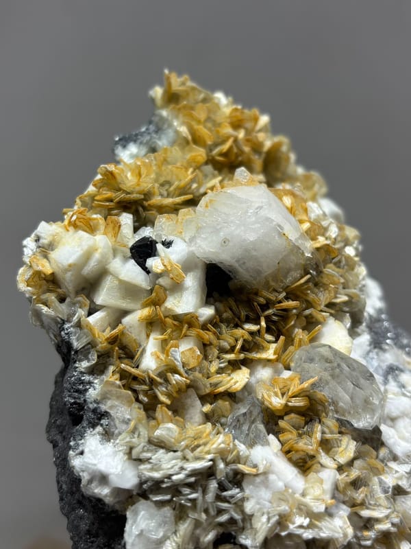 Golden mica and aquamarine cluster with cassiterite and quartz from Xuebaoding, Sichuan, China, second angle
