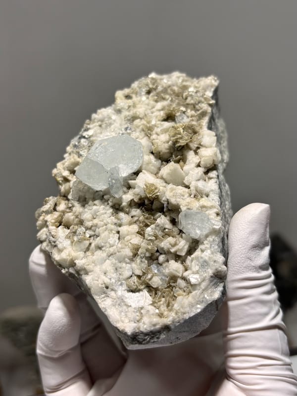Feldspar-mica plate with pale aquamarine from Xuebaoding, Sichuan, China, close-up of the crystal faces
