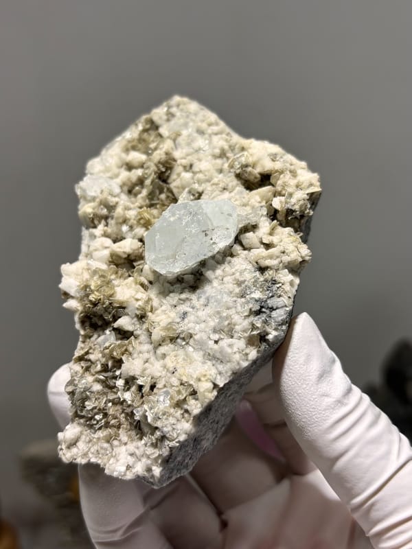 Feldspar-mica plate with pale aquamarine from Xuebaoding, Sichuan, China, reverse side
