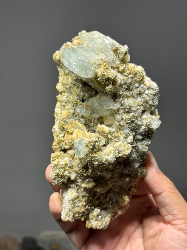 Mica plate with many aquamarine crystals from Xuebaoding, Sichuan, China, close-up of the crystal faces