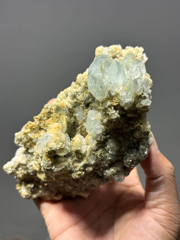 Mica plate with many aquamarine crystals from Xuebaoding, Sichuan, China, reverse side