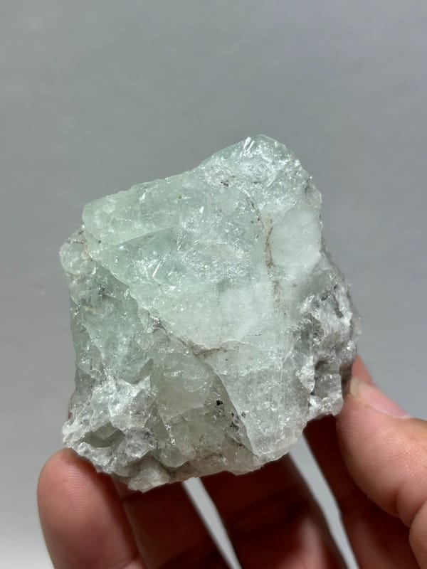 Single aquamarine crystal with unusual green tint from Xuebaoding, Sichuan, China, view 3 of 5