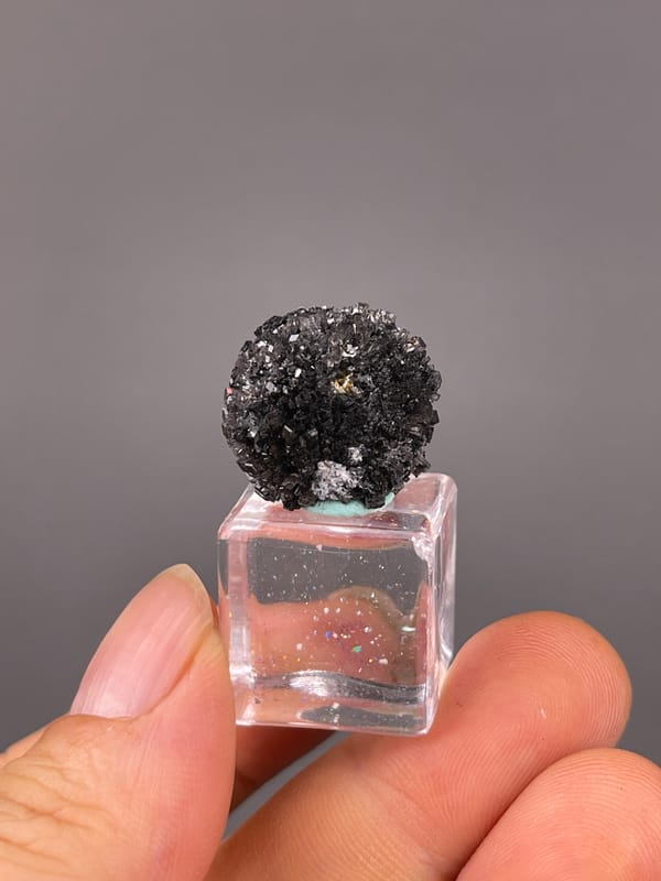 Aurora Calcite specimen from Longyan, Fujian, China featuring black spherical radiating aggregate