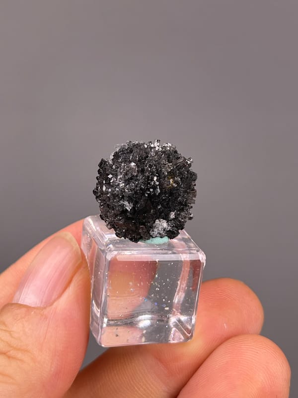 Aurora Calcite specimen from Longyan, Fujian, China, defined by black spherical radiating aggregate