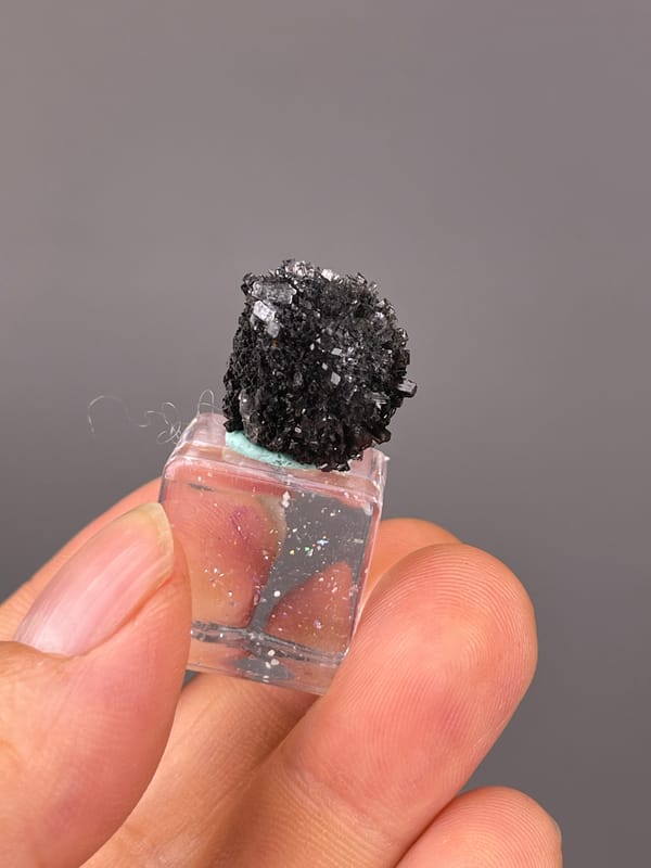 Aurora Calcite specimen from Longyan, Fujian, China presenting black spherical radiating aggregate