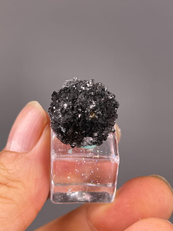 Aurora Calcite specimen from Longyan, Fujian, China highlighting black spherical radiating aggregate