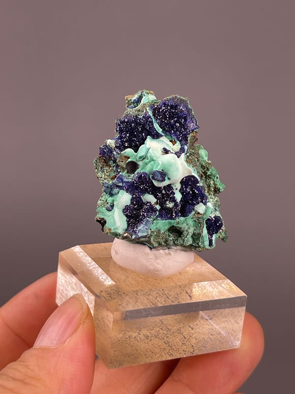 Azurite from Anhui, China: angled view of dark blue crystalline spheres.