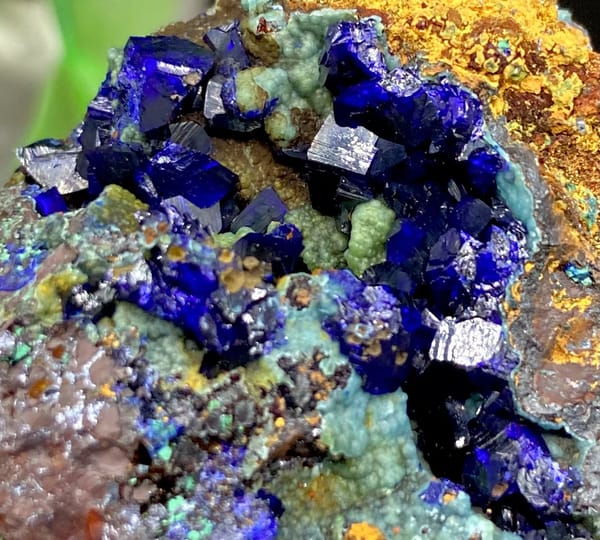 Deep blue azurite crystals with malachite and orange limonite from Anhui, China, view 2 of 9