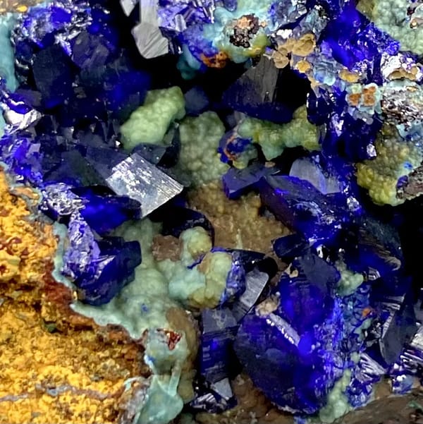 Deep blue azurite crystals with malachite and orange limonite from Anhui, China, view 4 of 9