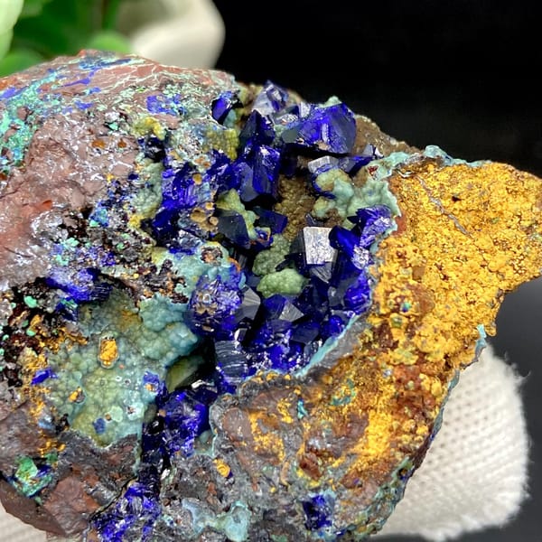 Deep blue azurite crystals with malachite and orange limonite from Anhui, China, view 5 of 9
