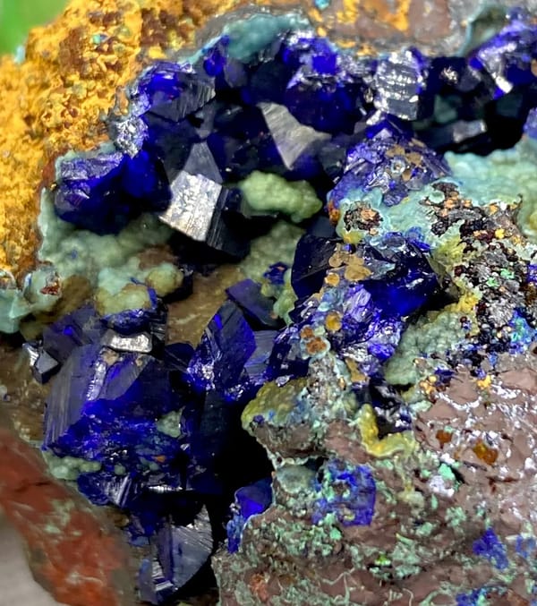 Deep blue azurite crystals with malachite and orange limonite from Anhui, China, view 6 of 9