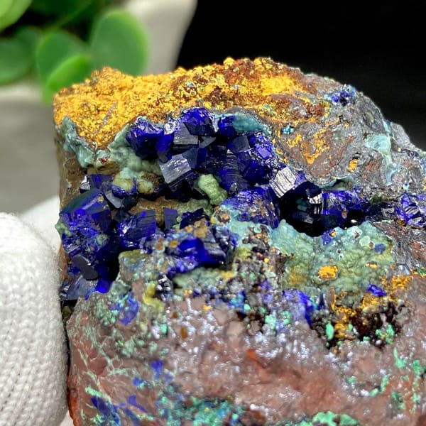 Deep blue azurite crystals with malachite and orange limonite from Anhui, China, view 7 of 9