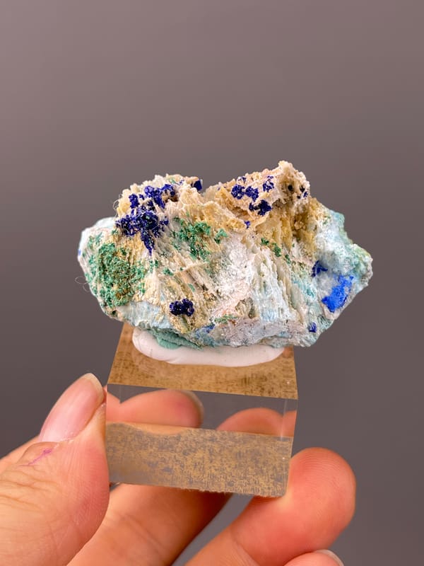 Azurite specimen from Qinglong, Guizhou, China featuring blue azurite and green malachite on white blades