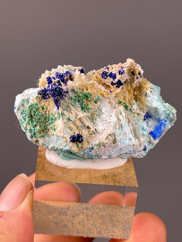 Azurite specimen from Qinglong, Guizhou, China showing blue azurite and green malachite on white blades