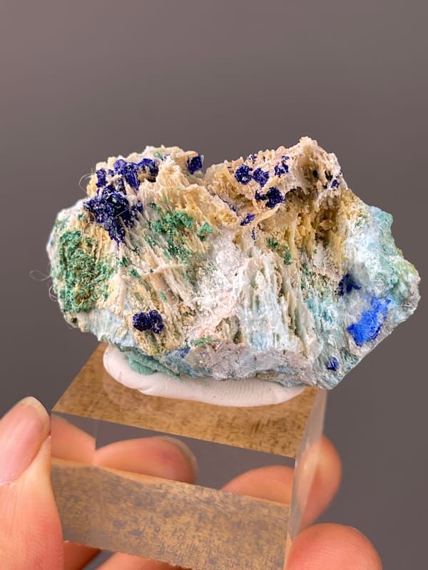 Azurite specimen from Qinglong, Guizhou, China presenting blue azurite and green malachite on white blades