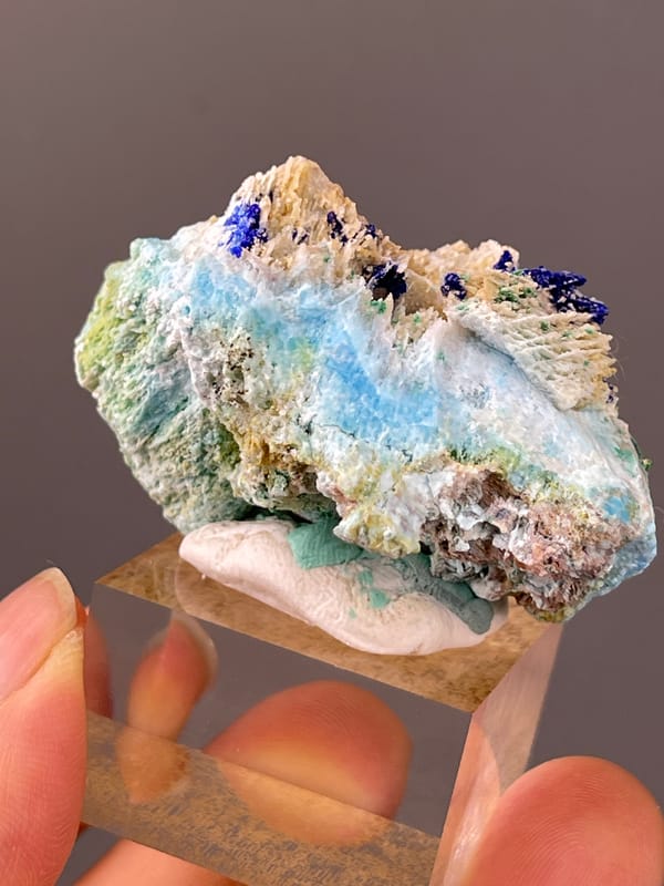 Azurite specimen from Qinglong, Guizhou, China highlighting blue azurite and green malachite on white blades