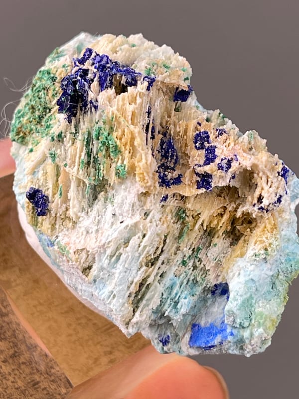Azurite specimen from Qinglong, Guizhou, China bearing blue azurite and green malachite on white blades