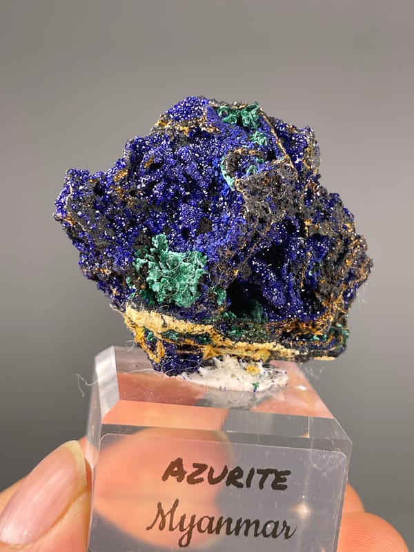 Azurite specimen from Myanmar showing royal-blue crystals with green patches