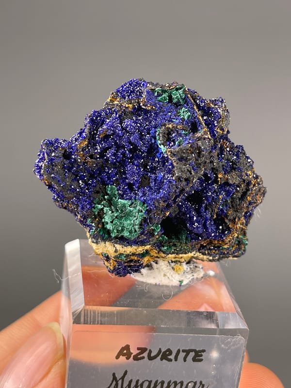 Azurite specimen from Myanmar, defined by royal-blue crystals with green patches