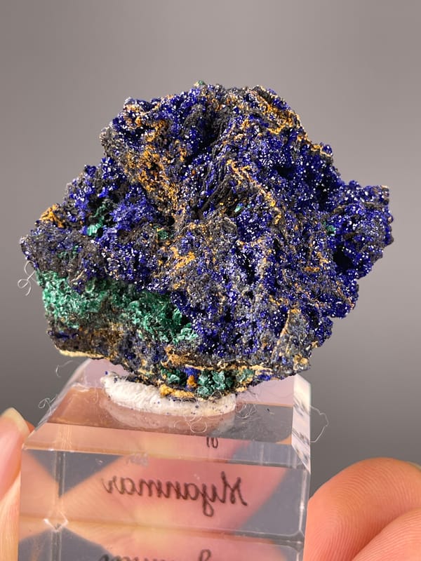 Azurite specimen from Myanmar displaying royal-blue crystals with green patches