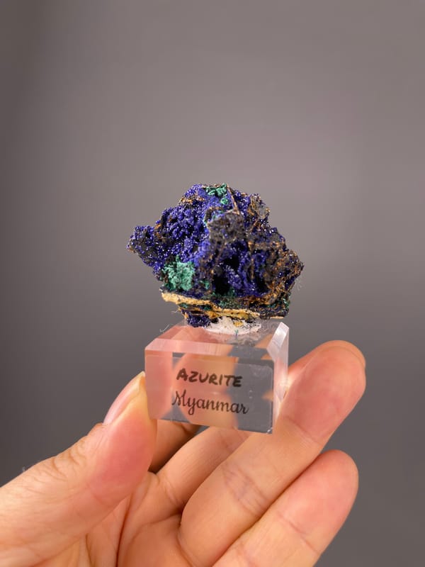Azurite specimen from Myanmar highlighting royal-blue crystals with green patches