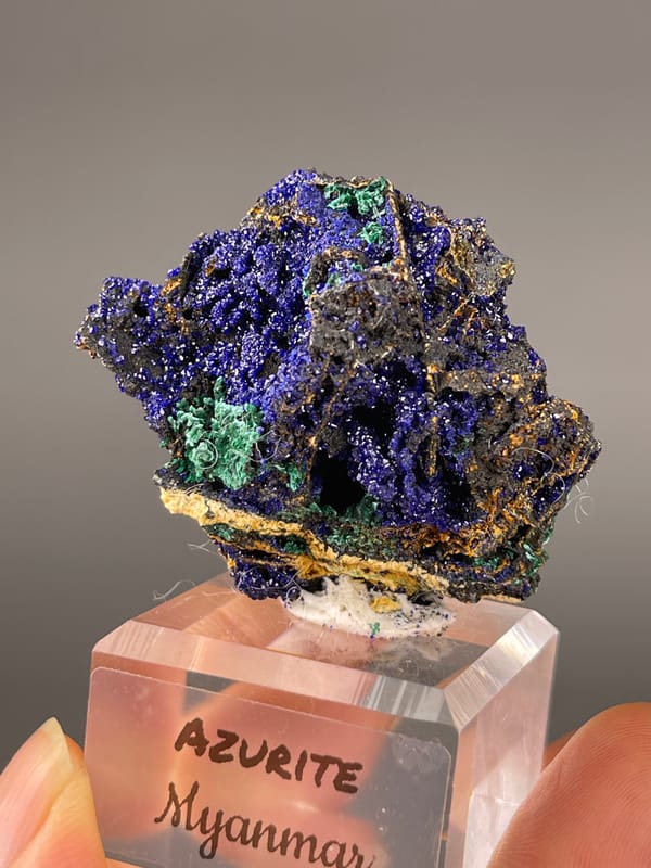 Azurite specimen from Myanmar bearing royal-blue crystals with green patches
