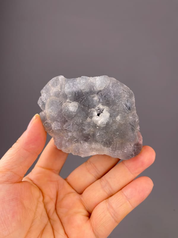 Bi-color Fluorite specimen from Zhejiang, China featuring gray-lilac aggregates with pale coating