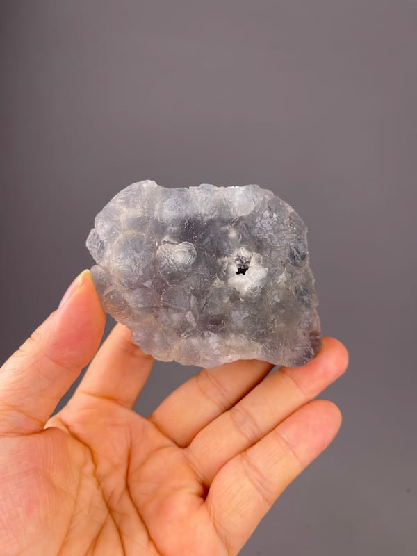 Bi-color Fluorite specimen from Zhejiang, China showing gray-lilac aggregates with pale coating