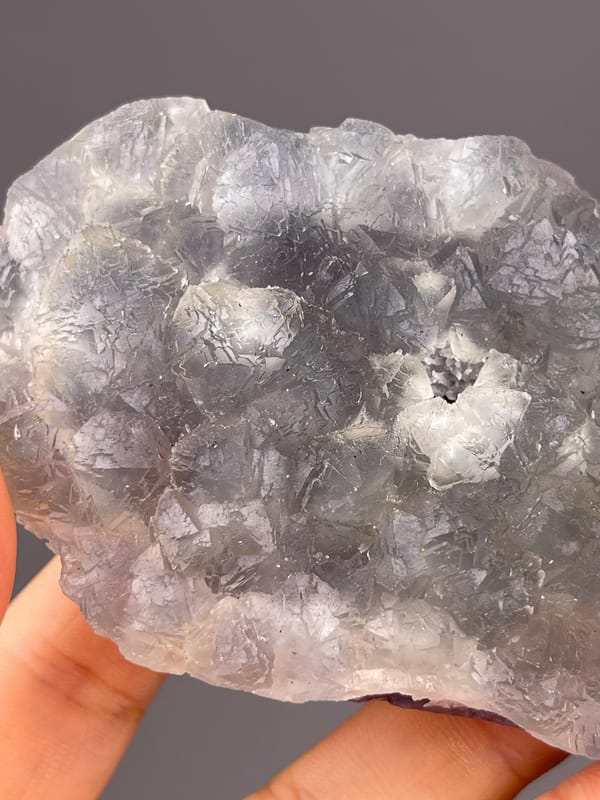 Bi-color Fluorite specimen from Zhejiang, China, defined by gray-lilac aggregates with pale coating