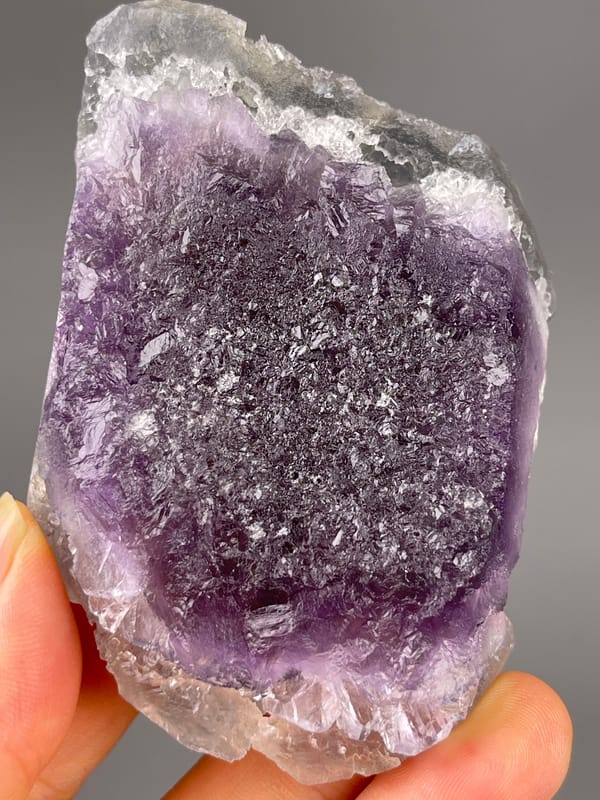 Bi-color Fluorite specimen from Zhejiang, China displaying gray-lilac aggregates with pale coating