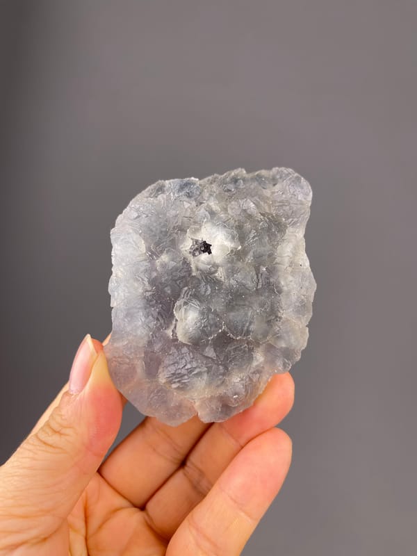 Bi-color Fluorite specimen from Zhejiang, China, characterized by gray-lilac aggregates with pale coating