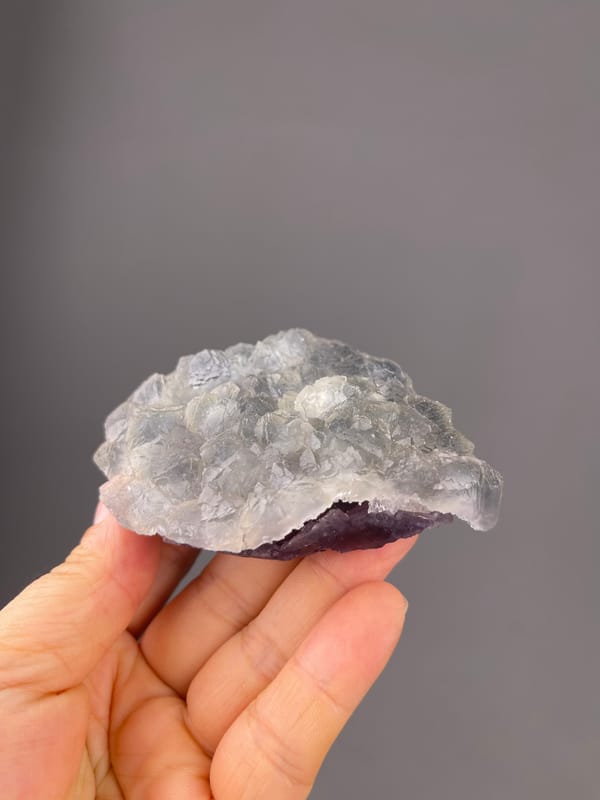 Bi-color Fluorite specimen from Zhejiang, China bearing gray-lilac aggregates with pale coating