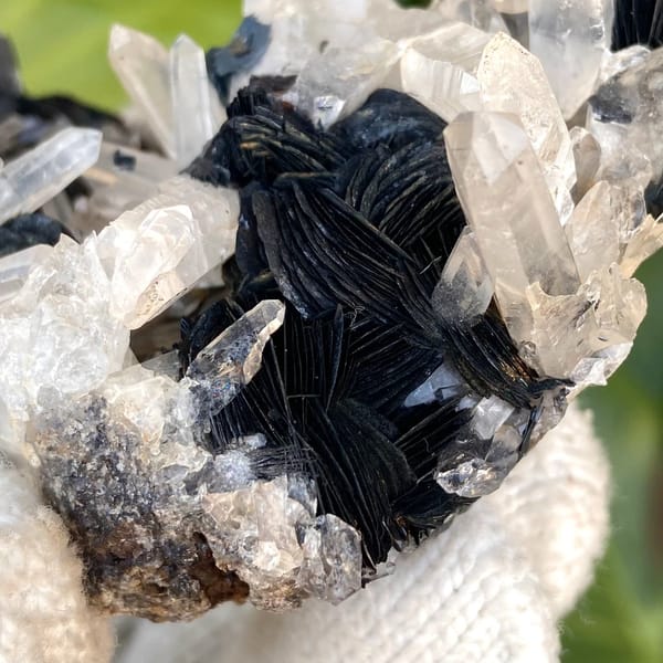 Black specular hematite rosettes with clear quartz prisms from Guangdong, China, view 5 of 9