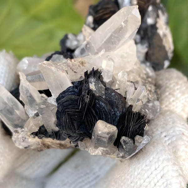Black specular hematite rosettes with clear quartz prisms from Guangdong, China, view 8 of 9