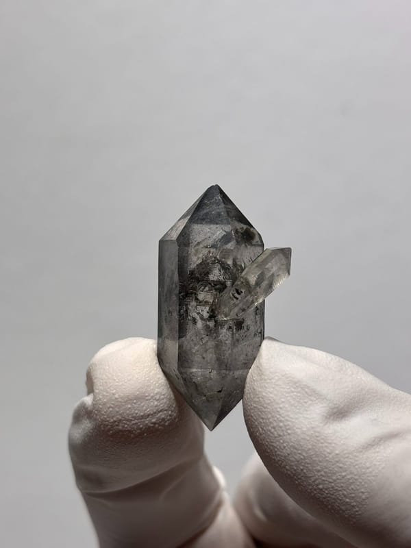 Stout black-flecked double-terminated quartz with side crystal from Yunnan, China