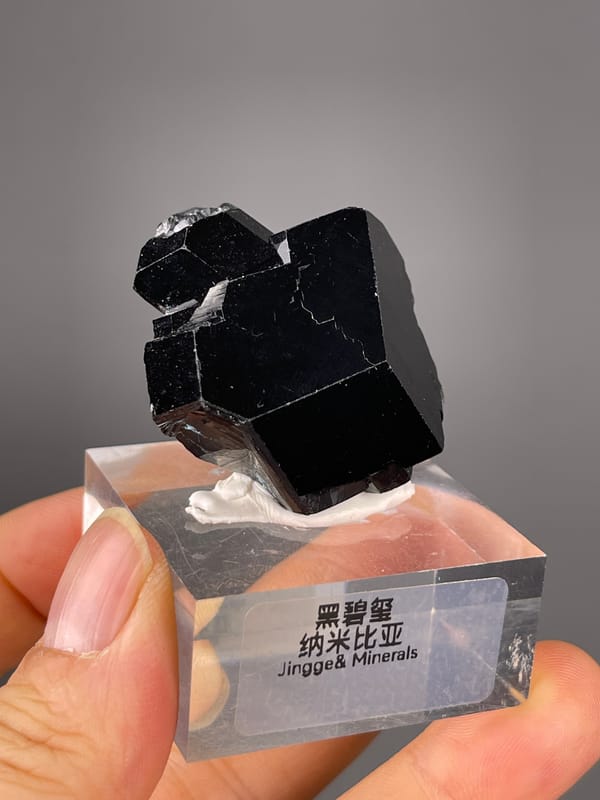 Black striated prismatic crystals visible on black tourmaline specimen from Namibia