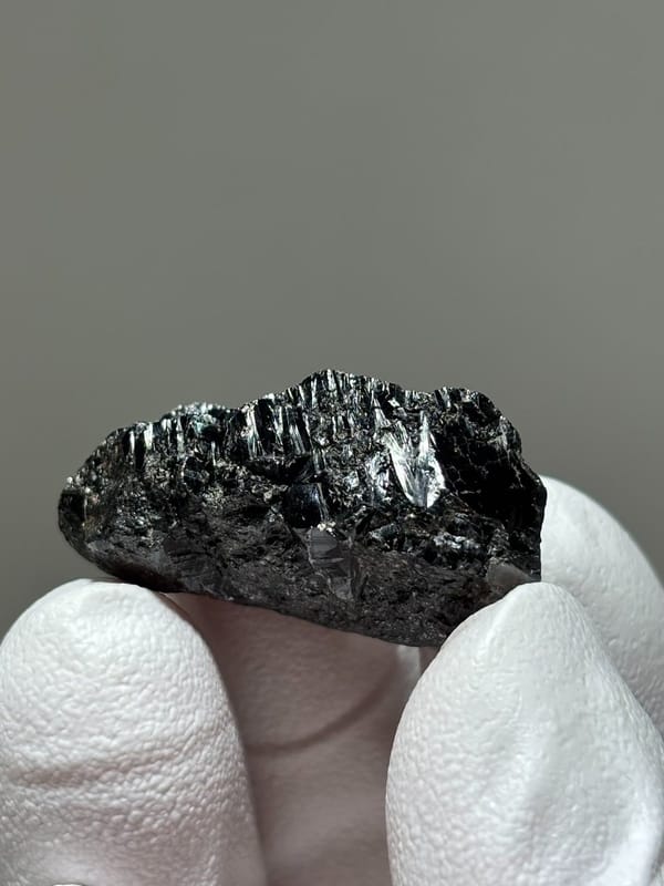 Bladed black cassiterite crystal from Xuebaoding, Sichuan, China